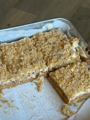 A pan of Salted Honey Cornbread bars being cut
